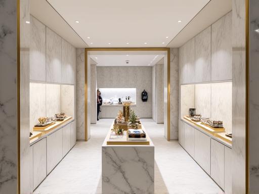 Intérieur d'une boutique de luxe minimaliste avec des présentoirs en marbre et laiton.